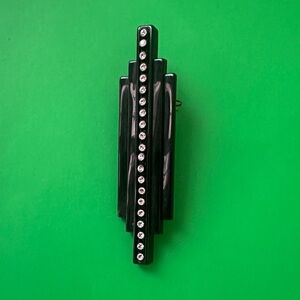 Black Louis Scherrer Brooch with Rhinestone Accents in plastic or Bakealite